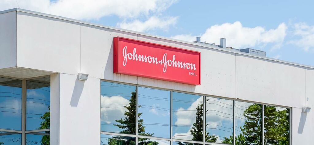 Johnson & Johnson reported revenue and profit growth and raised its forecast for the year